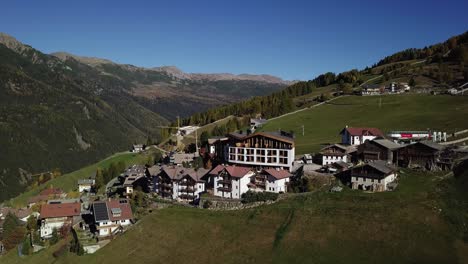 mountain hotel on a hill with houses and road and valley