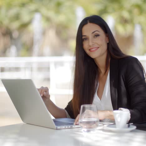 Pretty-stylish-woman-using-her-laptop