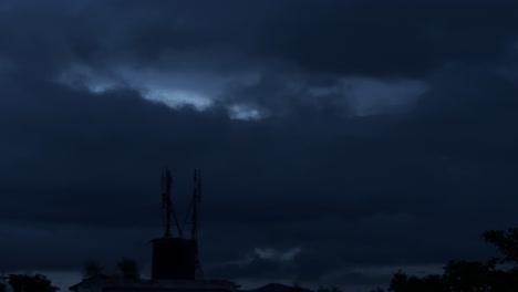 timelapse of dark stormy sky with fast moving clouds over the 5g mobile tower