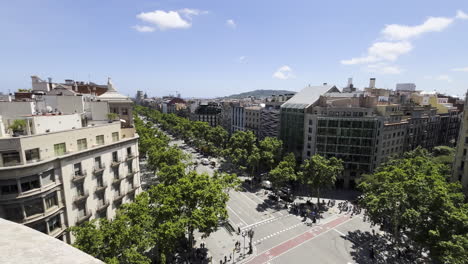 this clip shows a view of the streets of barcelona from the top of la casa milla designed by antoni gaudi