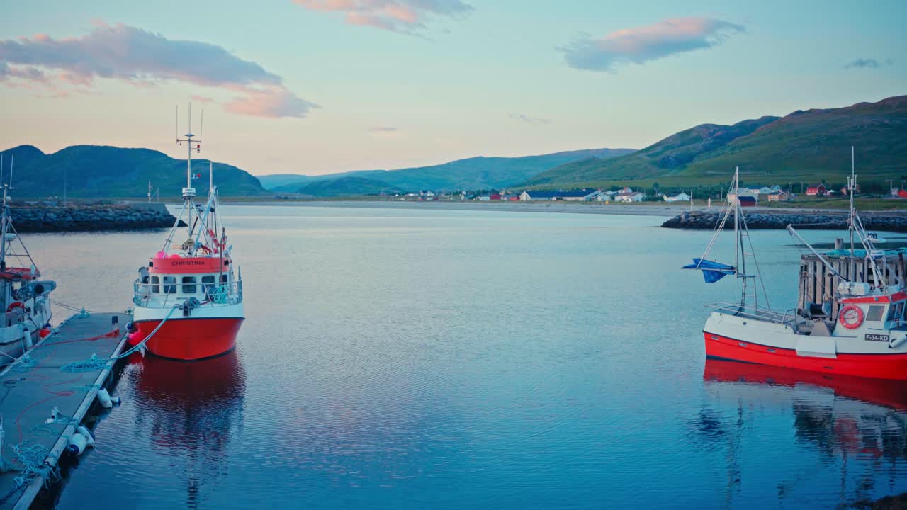 Kokelv, Hammerfest, Finnmark, Norway - Fishing Boats Rest Quietly in a Peaceful Harbor as the Sun Sets - Handheld Shot