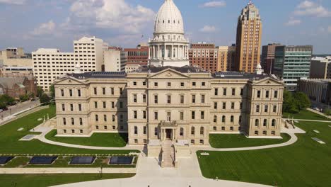 aerial view of the historic michigan state capitol building and downtown lansing