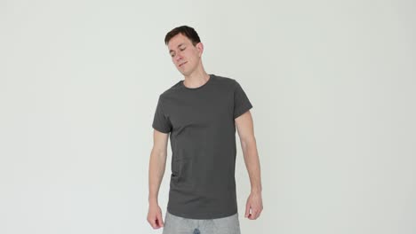 man in grey t-shirt against white background