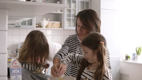 Beautiful-family-are-cooking-together-on-the-kitchen