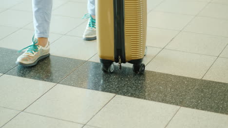 woman wheels suitcase