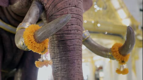 marigold garland  on elephants statues in diwali festival