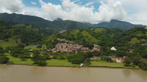 aerial view of a village nestled in a lush green valley