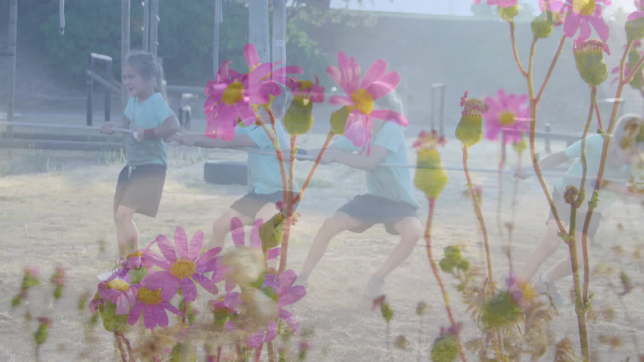 In school, children playing tug-of-war with animation of vibrant pink flowers