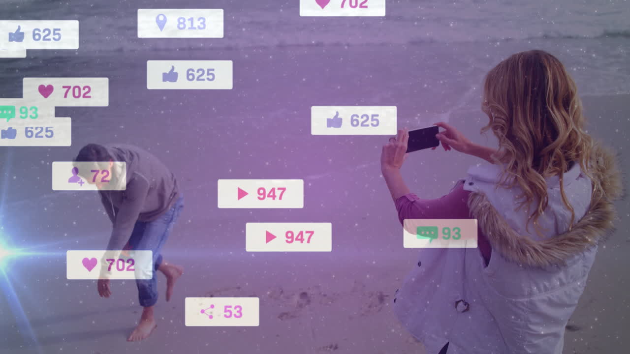 At beach, people receiving social media notifications with animation overlay