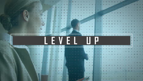 Animation of level up text over caucasian businesswoman using smartphone