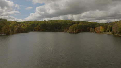 Flyover-beautiful-lake-in-the-Hudson-Valley-area-of-New-York-state-on-a-beautiful-day-in-Autumn