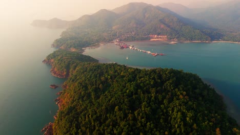 aerial fly peninsular blue lagoon landscape in koh chang thailand, beach sea forested relaxed travel destination