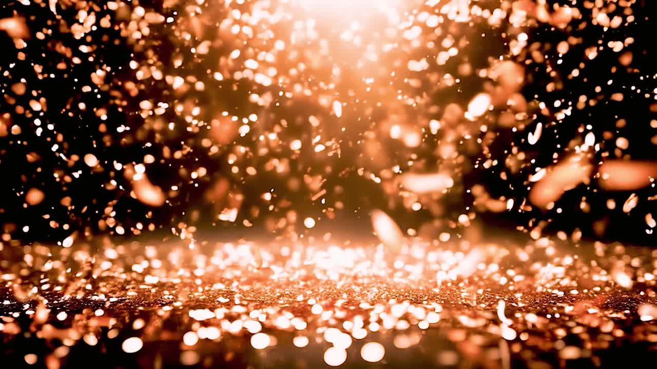 Particelle di glitter dorate che cadono con luce bokeh brillante