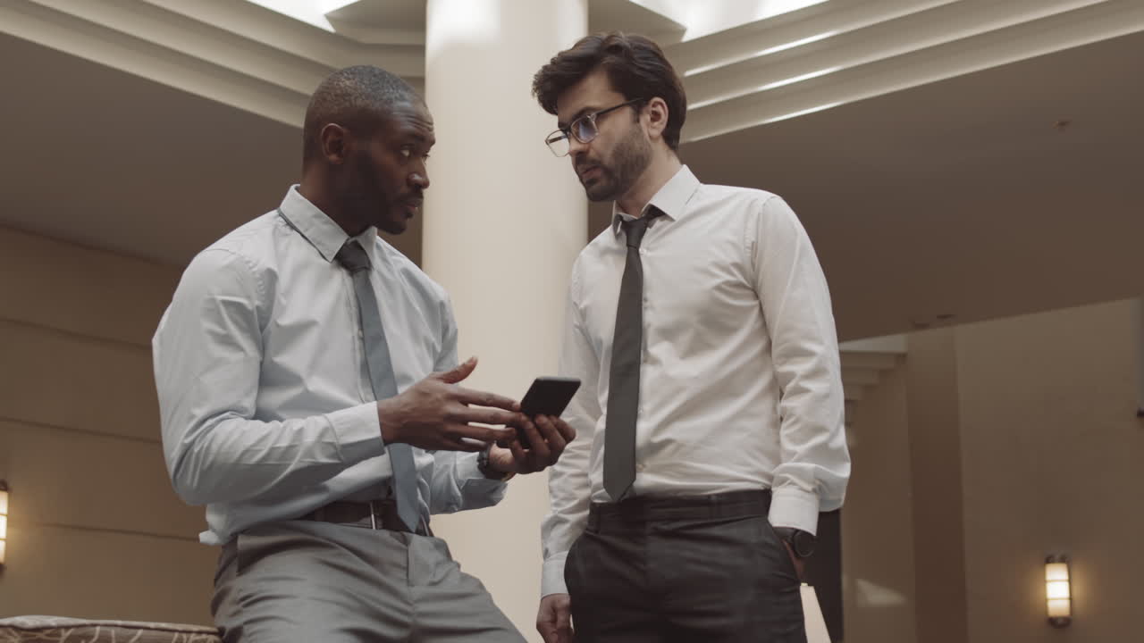 Office Workers Having Conversation