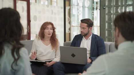 Business-Meeting-Between-Two-Women-And-Two-Men-At-An-Office-2