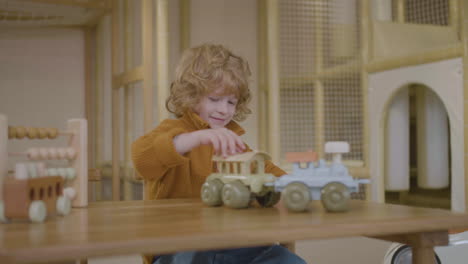 little boy playing with eco toy