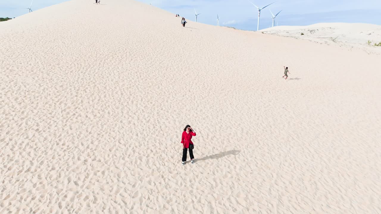 Aerial View of a Girl Standing in the Desert in Vietnam.