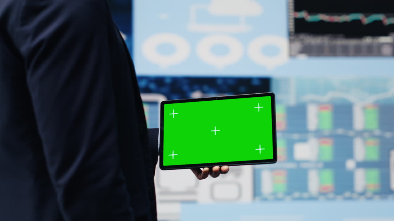 Young male boss holding tablet with copy space to explore new finance strategy
