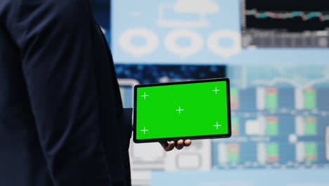 young male boss holding tablet with copy space to explore new finance strategy