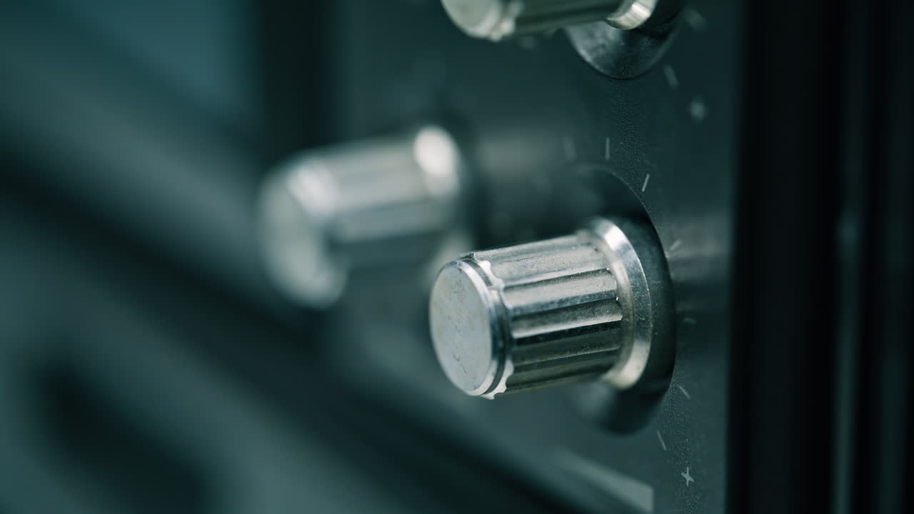 Macro fingers touching knobs radio player. Unrecognizable man regulating volume