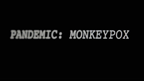 TYPING-OUT---Monkeypox,-white-letters-on-black-background