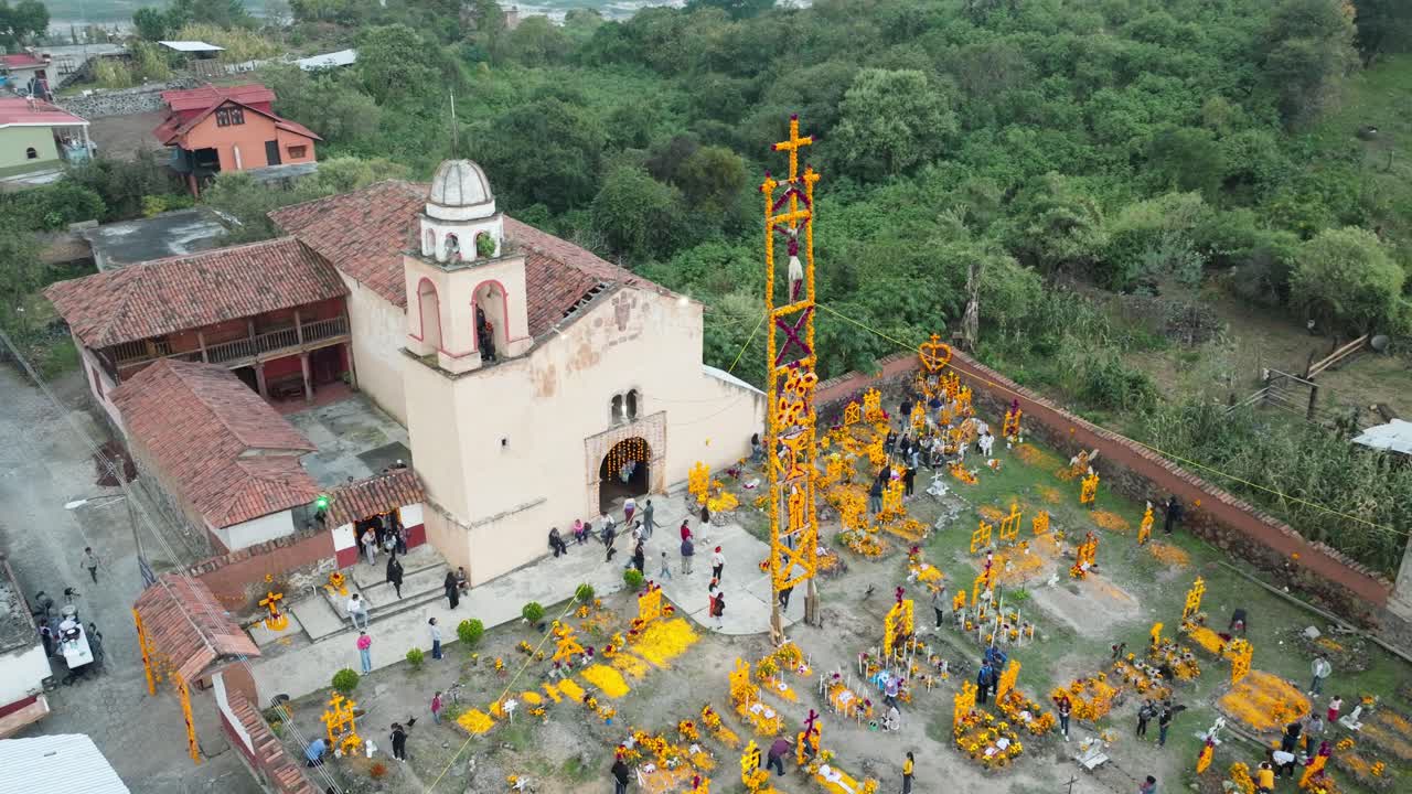 DRONE: HALF OBIT OF AROCUTIN MICHOACAN CHURCH AND GRAVEYARD AT DAY OF THE DEATH