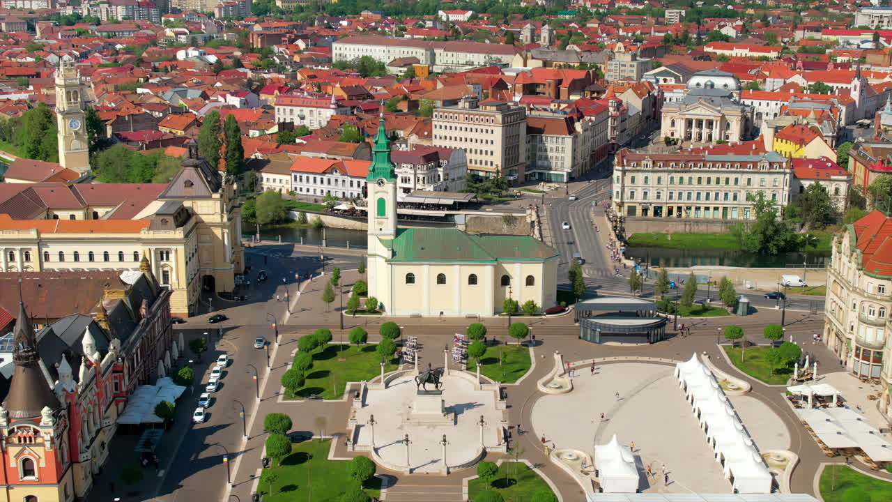 Areal drone view of the Unirii Square in Oradea downtown, Romania. King Ferdinand I statue, Saint Ladislaus Church, Town Hall and other historical buildings