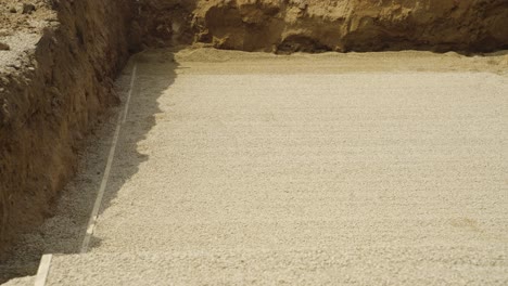flat gravel layer finished in trench for residential pool build in wisconsin