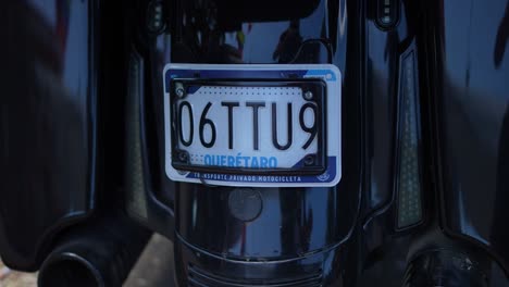 motorcycle plate, biker gang member, riding his harley davidson