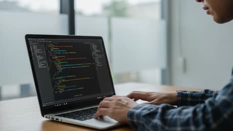 focused on coding: a programmer's journey through lines of code on a laptop in a modern workspace, captured in dynamic frames reflecting creativity and innovation