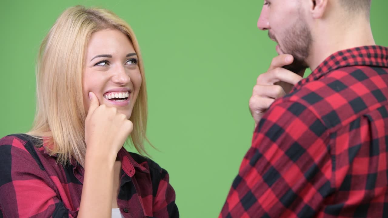 Young couple thinking while looking at each other