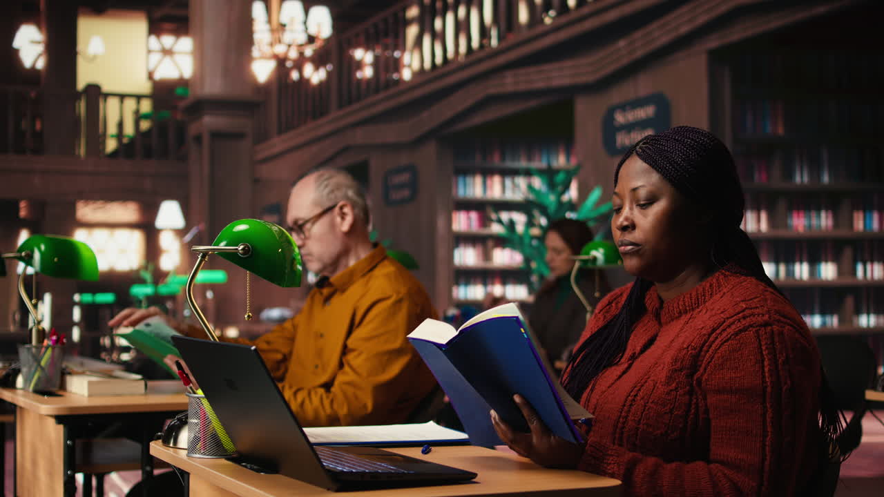 People reading and studying in a library