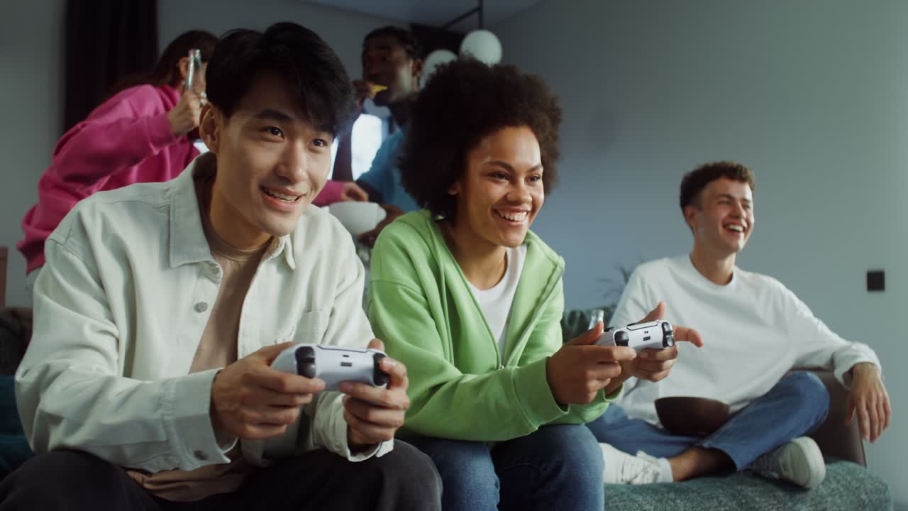 Group of friends playing video games together