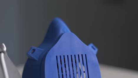 dolly shot of 3d-printed plastic masks produced during the covid-19 outbreak
