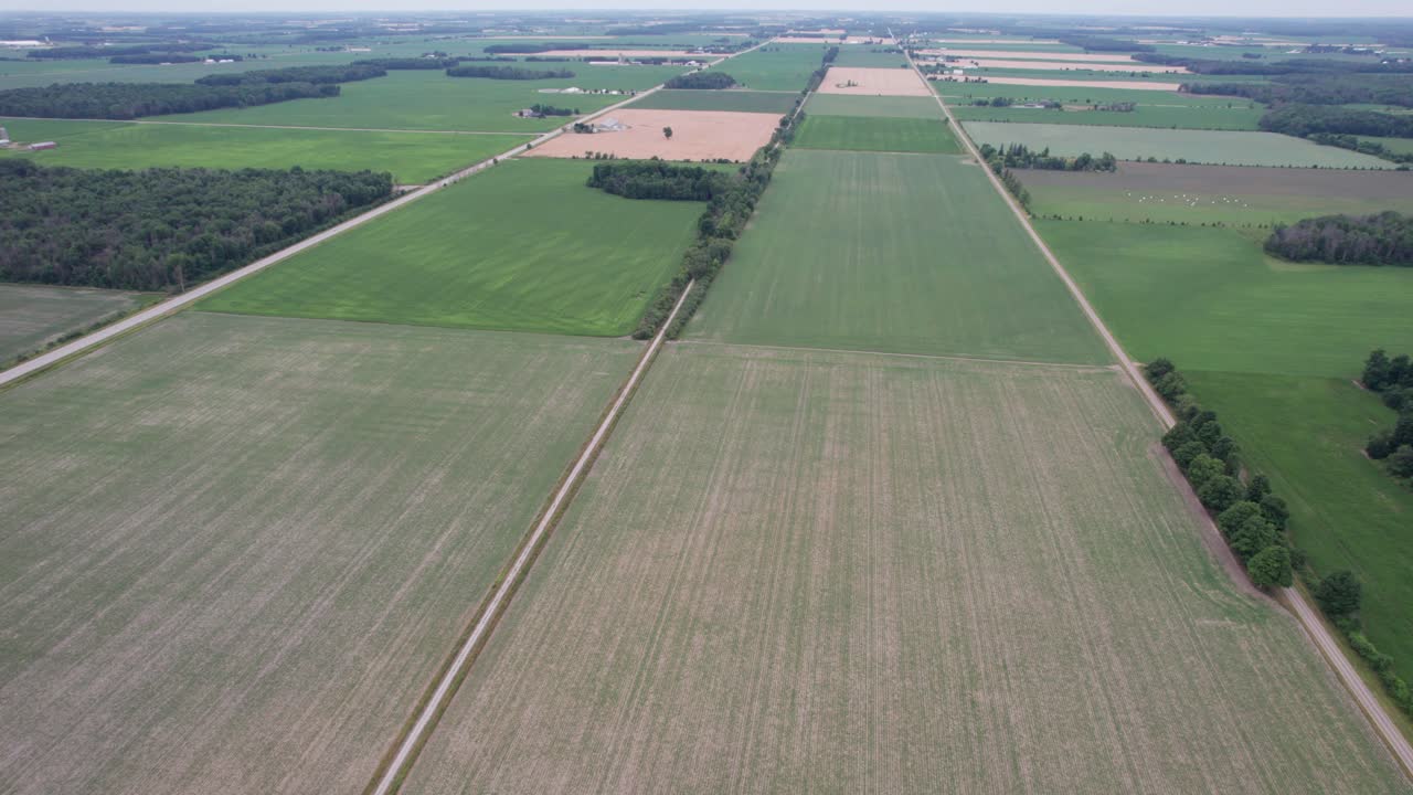 Slow Dolly in from the Air over Farm Country, Ontario, Canada