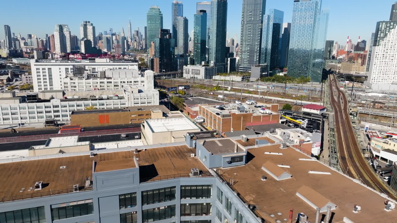 Aerial view over a building project, toward the Brooklyn skyline, in sunny NY