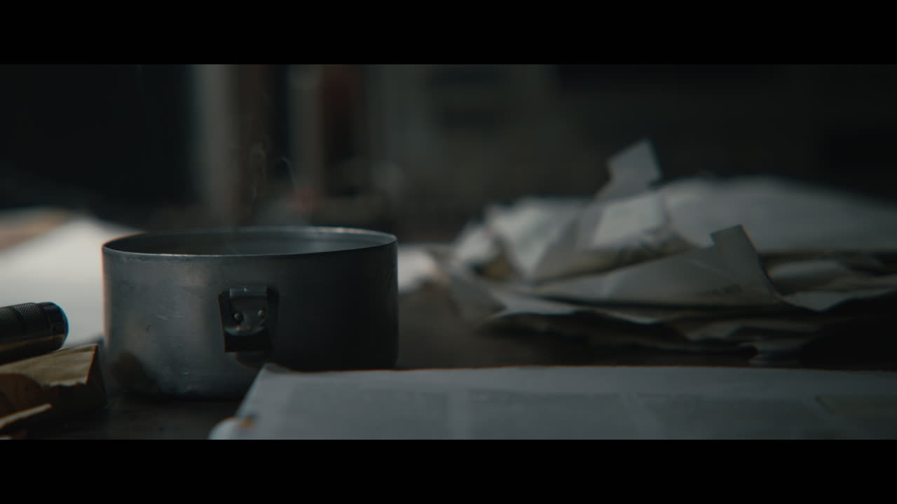 An intelligence officer takes ligter and cigarettes