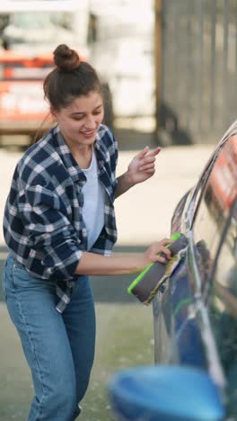 woman washing a car