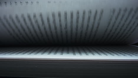 macro shot leafing book pages. closeup turning pages of book