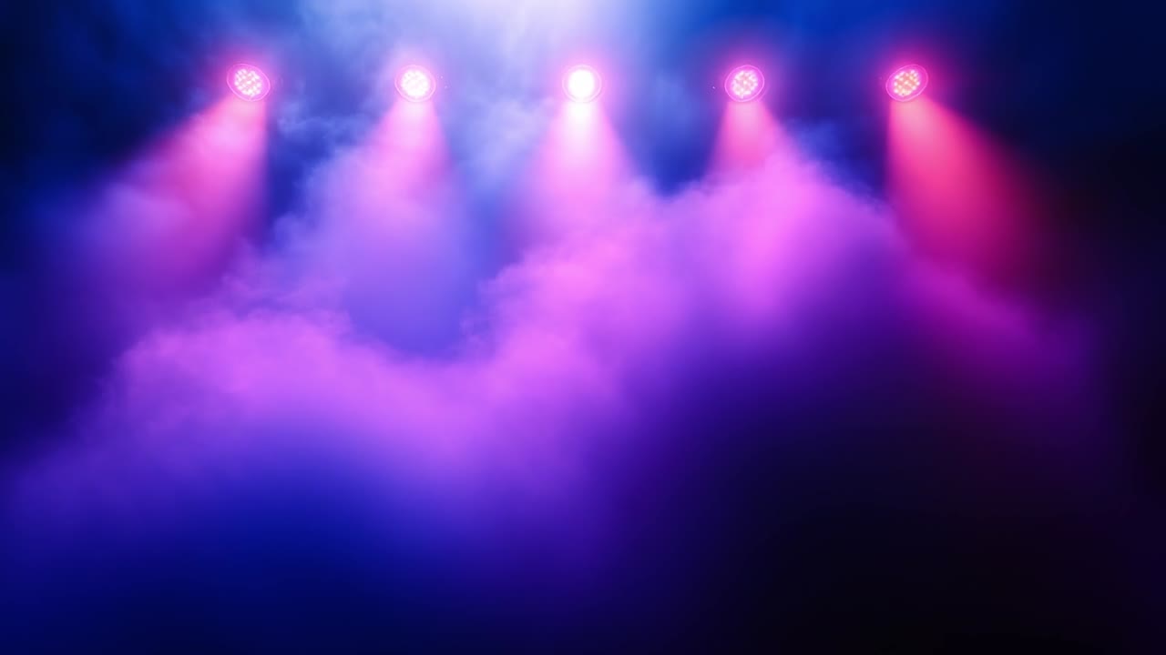 Bold lighting sets vibrant mood. Colorful stage lights illuminate a foggy environment, creating an engaging and dynamic ambiance for a performance.
