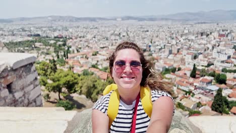 smiling tourist's selfie overlooking athens, greece