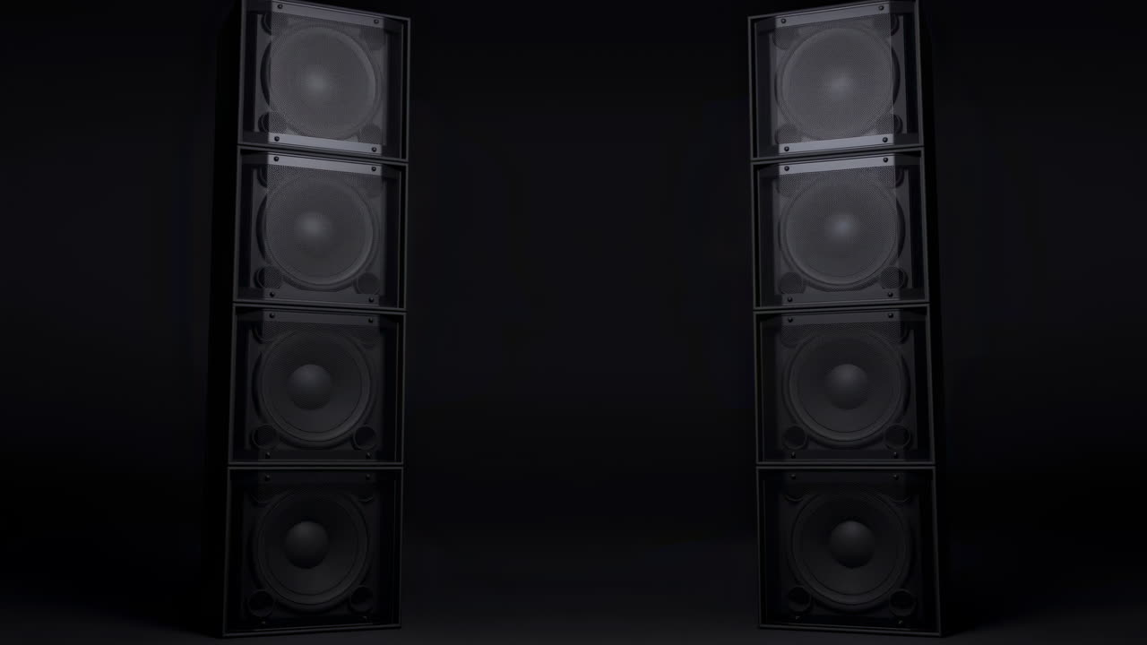 Large Black Speakers Pulsing with Bass on Dark Background
