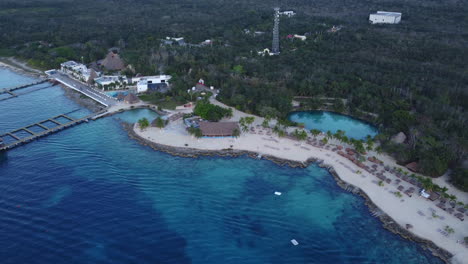 Cozumel-cenote-lake-sea-blue-ocean-island-mexico-vacation-holiday-rest-relax-tropical-paradise-green-nature-palm-tree-aerial-drone-boat-coral