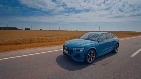 audi e-tron on highway road. audi e-tron in motion at speedway road