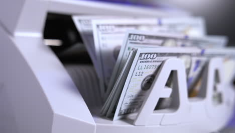 machine for counting money. cash electronic banking counter with a lot of dollars. money and economics concept. horizontal view