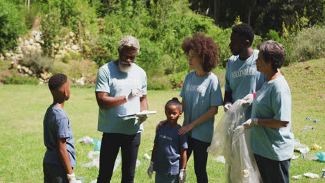 happy family cleaning a garden together