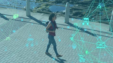 animation of network of connections with technological icons over woman walking on park