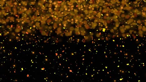 Gelbes-Konfetti-Und-Leuchtende-Flecken-Vor-Schwarzem-Hintergrund