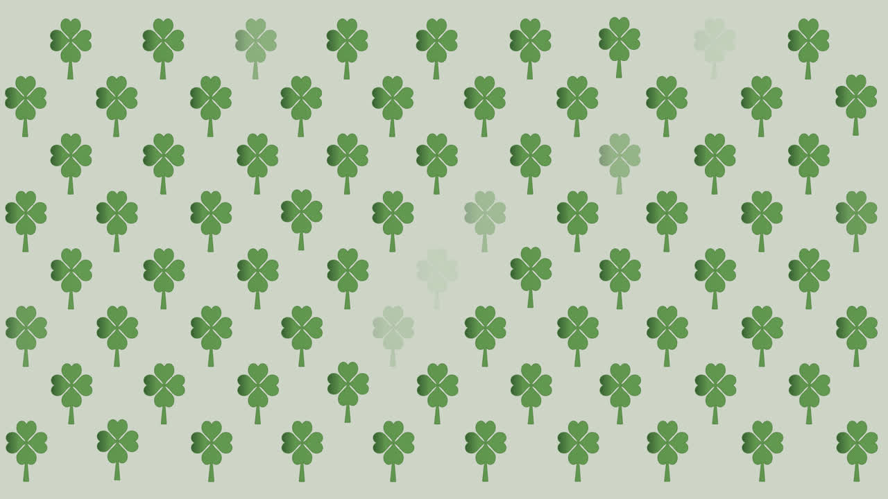 Digital animation of multiple clover leaves flickering against grey background