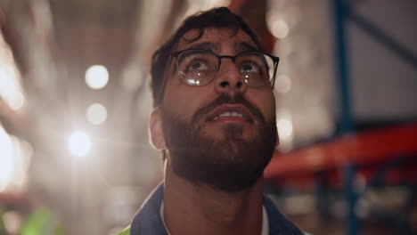 man in warehouse looking up